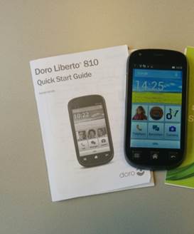 Foto van de telefoon, de quick start guide en de A staat voor App folder